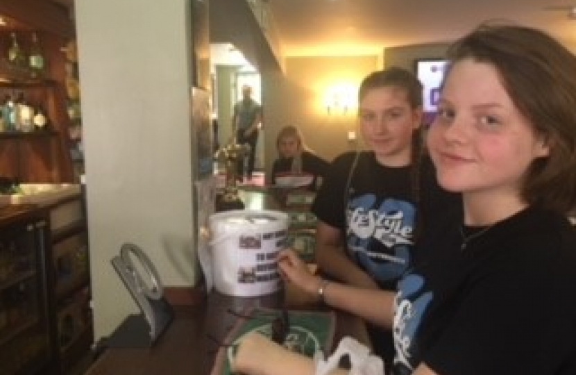 Jess and Amelia raising money for the Walkington defibrillator with charity collection buckets