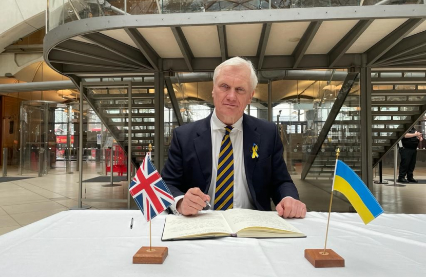 Graham Stuart MP signing book of solidarity 