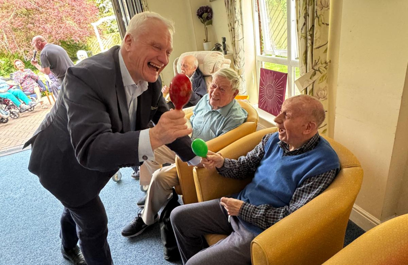 Graham Stuart playing music with the residents at Beverley Grange Nursing Home