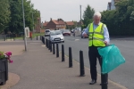 Graham litter picking in the Samman road play area.