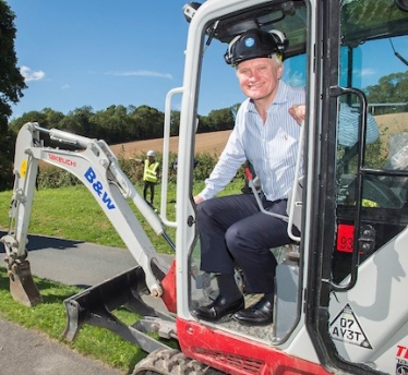 Graham sitting in an excavator