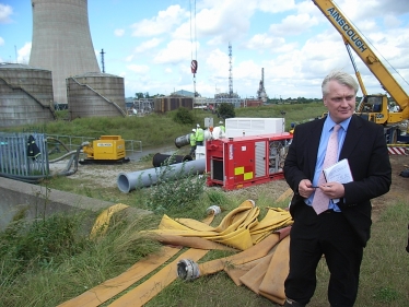 Graham standing at a pumping station in Burstwick