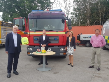 Graham with new defibrillator with (L-R) Geoff Holmes (px Group) Cllr Sue Steel Nick Granger (HFR Solutions)