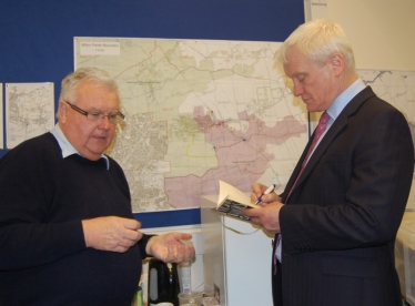 Parish Clerk, Stephen Dale, briefs Graham in front of the Emergency Plan map