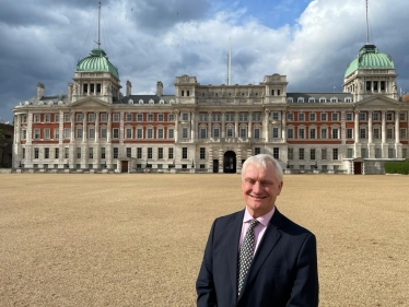 Graham in front of OAB (standing sideways)