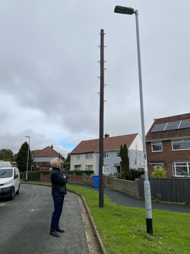 Graham looking at telegraph pole Hedon